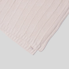 Light pink textured fabric on a light gray background