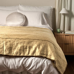 Paloma Bed End Blanket from Bella Notte Linens in the color Honeycomb displayed on a bed with shams and a duvet also from Bella Notte Linens. 