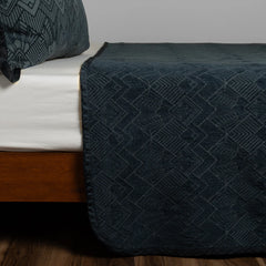 Trettino Bedspread from Bella Notte Linens in the color Midnight.