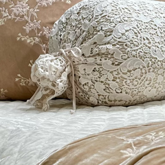 Close up of the Silk Velvet Quilted Coverlet from Bella Notte Linens in the color Crema. 